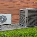 Outdoor air conditioning units on concrete, featuring wall-mounted and ground types for Hancock & Son services.